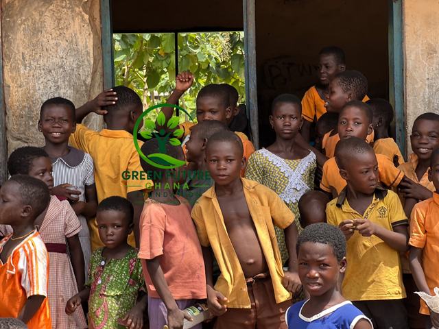 Children in school uniforms crowding at a classroom doorway